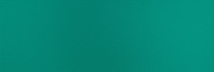 a seamless texture of slightly textured colored paper in blue green color