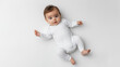 © Sean - Adorable baby lying on back wearing white onesie mockup