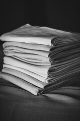 Poster - A collection of folded towels arranged neatly on a table, ideal for use in interior design or lifestyle photography