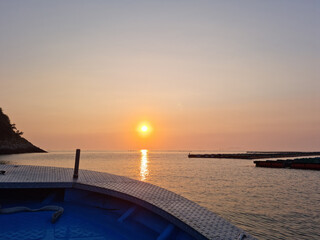 Wall Mural - Sunset view of the sea with a bow.
