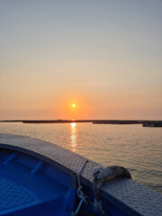 Wall Mural - Sunset view of the sea with a bow.