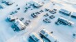 © thanarak - Aerial View of Snow Covered Military Outpost in Arctic Terrain