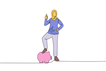 Poster - single continuous line drawing arab businesswoman with thumbs up pose and steps on piggy bank. invit