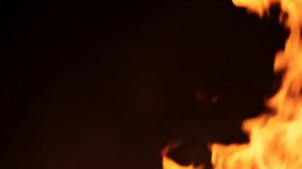 Leinwandbilder - A close up of a fire with orange flames