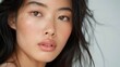 © MyDorkyDolphin - A close-up portrait of an Asian model with flawless skin, wearing minimal makeup and a soft expression, set against a neutral, blurred background. 8k UHD, suitable for high-quality printing