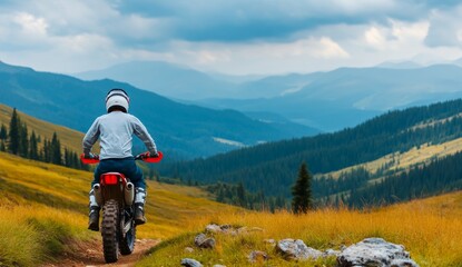 Wall Mural - A man riding an motorcycle on a dirt road in a forest