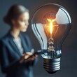 © Hansa & Party - A light bulb containing an image of a woman holding a tablet, analyzing data, symbolizing the role of technology in business