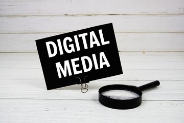 Aufkleber - Digital Media text message on paper card with magnifying glass on wooden background