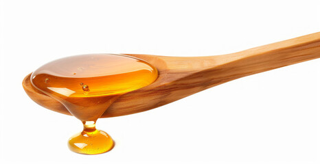 Honey dripping from a wooden spoon, isolated on a white background.