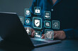 © Antony Weerut - Insurance concept. Businessman using laptop with insurance policy online icons for medical health, travel, cars, property, finance and family. service Insurance online cyber security privacy.