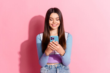 Wall Mural - Photo of lovely charming cheerful girl wear trendy clothes isolated on pink color background