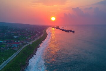 A beautiful sunset over the ocean with a few boats in the water