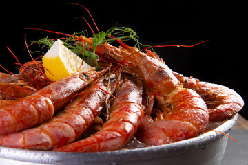 Wall Mural - Large cooked shrimp on a dark background.