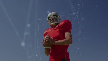 Poster - American football player holding ball, network connections animation over blue sky