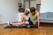 © Barillo_Images - Male athlete doing fitness exercise using foam roller, home workout.