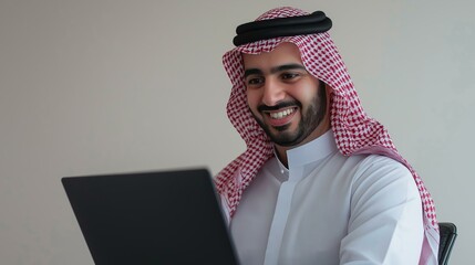 Wall Mural - Arab businessman using a laptop  isolated background