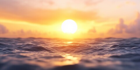 Stunning Sunset Over Gentle Ocean Waves with Sunlight Reflecting on Water