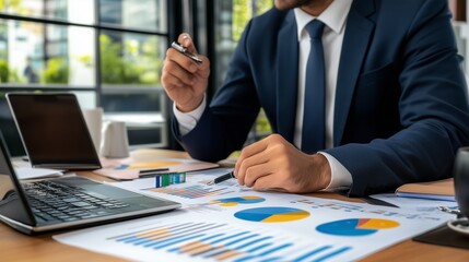 Poster - Business professional analyzing reports on a desk with charts and graphs in a modern office setting during daytime