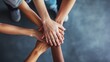 © fotofabrika - Hands joined together in teamwork during a collaborative effort in a community setting at midday
