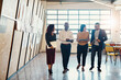 © peopleimages.com - Business people, walking and discussion in office for teamwork, research or planning project together. Startup, technology and creative agency with digital company partnership in workplace for media