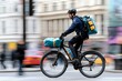 © woters - Delivery cyclist navigating a busy urban street while transporting food packages on a rainy day