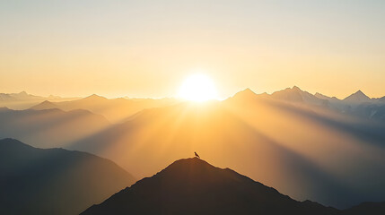 Wall Mural - The sun descends over mountains as a bird rests atop a peak