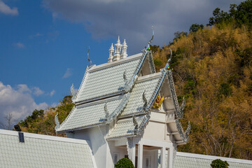 The temple's chapel has a beautiful white roof.