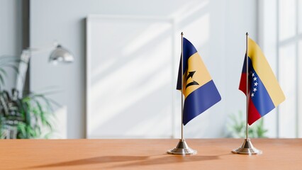 FLAGS OF BARBADOS AND VENEZUELA ON TABLE