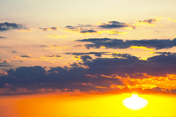 beautiful sunset aftermath, where the sky glows with rich, warm colors of orange and pink, slowly cooling to deep blue, creating a serene and captivating evening sky