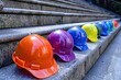 © eartist85 - Multicolored safety construction worker hats.