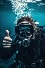 Diver in deep sea with thumbs up gesture