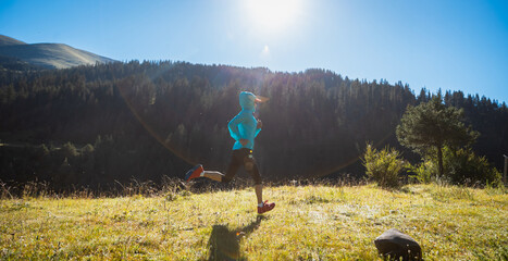 Sticker - Fitness asian woman runner running at sunrise grassland