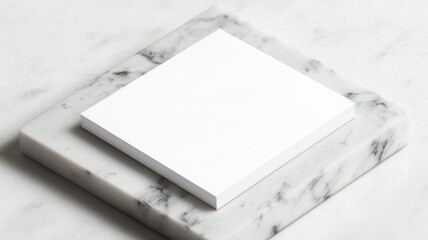 Clean white business card on a marble surface, sharp shadows, professional branding concept