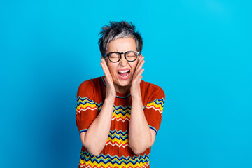 Sticker - Photo of nice aged woman closed eyes scream wear t-shirt isolated on blue color background