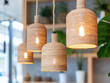 © Анастасия Ареховская - Close-up photo of pendant handmade lamps with frames wrapped in jute.