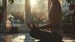 © basketman23 - A person starting their morning with yoga, stretching and meditating to prepare for the day ahead.