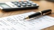© Naknakhone - A close-up of a document showing insurance premium amounts, with a calculator and pen nearby.