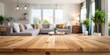 © InspireStock Gallery - Empty wooden table with blurred living room background for product display montage