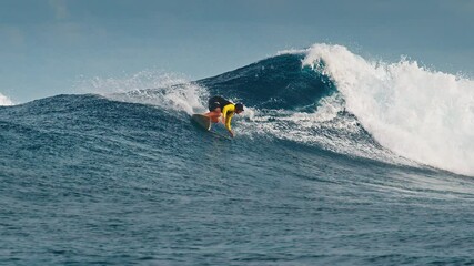 Poster - Experienced surfer rides the ocean wave at the famous Sultans surf spot on the North Atolls in the Maldives