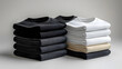 © Warakorn - Neat T-shirt Display: A mockup featuring a stack of black and white square t-shirts, folded precisely on a white background, ideal for modern apparel presentations.