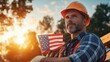 © bteeranan - American Construction Worker Holding Flag at Sunset