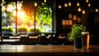 © Weerapat - A refreshing glass of beer next to a plant on a rustic table, with warm sunlight streaming through a cafe window.