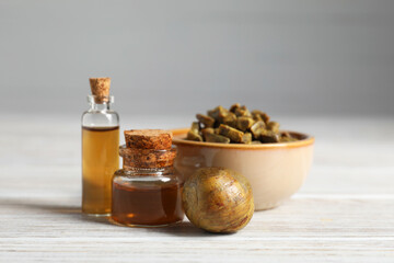 Sticker - Natural honey tincture and propolis granules on white wooden table