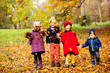 © oksix - Group of friends play in autumn park