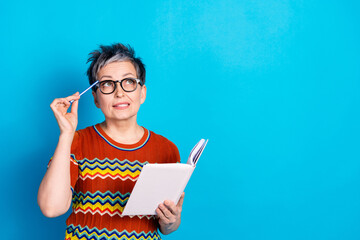 Sticker - Portrait of nice aged lady notepad pen look empty space wear t-shirt isolated on blue color background