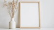 © creativeideh - Minimalist Home Decor with a Wooden Frame and Dried Flowers in a Vase