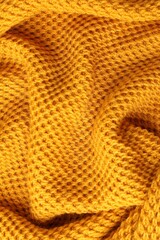 Canvas Print - Texture of orange knitted fabric as background, top view