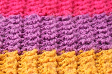 Poster - Texture of colorful knitted fabric as background, closeup