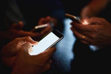 Poster - Phone, mockup and hands of people in club or bar for sharing code on media, mobile app or technology. Night, circle or group of friends in pub for gambling, online betting or notification on screen