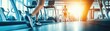© Sodapeaw - People exercising on treadmills in a modern gym with sunlight streaming through the windows, focusing on fitness and health in a bright environment.